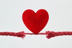 Heart on nearly broken rope - Concept of love and risk