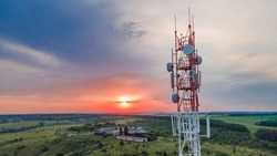 Telecommunication tower Antenna at sunset. Technology on the top of the telecommunication GSM 5G and 4G tower