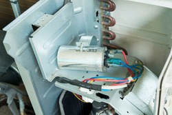 Air conditioner capacitor, Checking air compressor capacitor, Home appliances repair service.