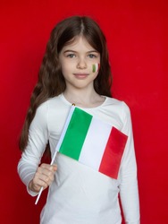 Portrait of a cute girl with an Italian flag, the concept of learning Italian, online language school, immigration and study in Italy