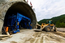 Construction site of excavator and tunnel engineering in highway construction in China