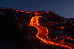 River of pahoehoe lava flowing down a cliff