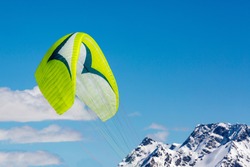 Parachute against the background of mountains and blue sky