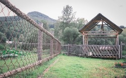 An old rustic traditional cnain fence colored