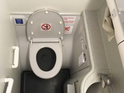 Photo of a lavatory in commercial airplane.
