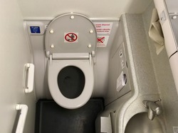 Photo of a lavatory in commercial airplane.