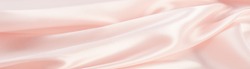 The texture of the silk fabric, soft pink.  rose-color, rose-colour, rose. Beautiful soft crumpled pink silk texture