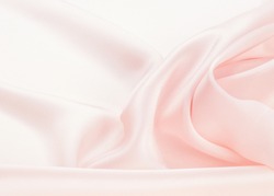 The texture of the silk fabric, soft pink.  rose-color, rose-colour, rose. Beautiful soft crumpled pink silk texture