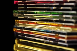 the stack of CD boxes on a dark background