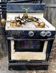 Filthy, unhygienic abandoned gas stove.