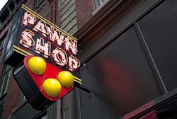 Neon pawn shop sign.