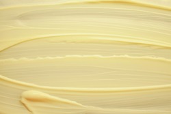 Face or body cream banana yellow texture background