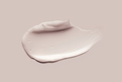 Liquid cream cosmetic smudge texture gray beige background