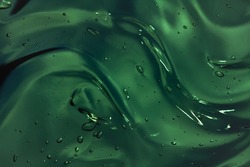Deep dark green gel smudge cosmetic texture background