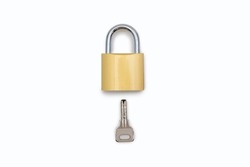 Closed padlock with a key on a white background. Golden color lock with a silver key on an isolated white background. The concept of protection and security in the form of a lock