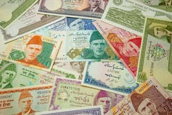 Made the Pakistani Rupee (PKR) banknotes from Pakistan as background