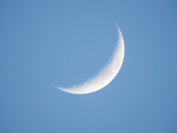 Crescent moon in the morning with clear blue sky