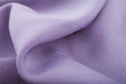 Lilac cloth fabric texture. Beautiful draperies