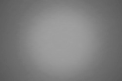 Grey color background texture with dark vignette. Gray blurred background abstract with copy space for design. 
