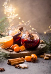 Christmas mulled wine delicious holiday like parties with orange cinnamon star anise spices. Traditional hot drink or beverage, festive cocktail at X-mas or New Year