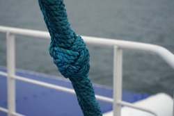 Sailing ship knob on the blue thik rope.