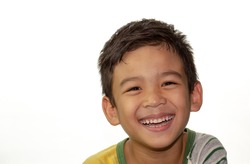 Cute little boy with healthy smile.  Close up face portrait Asian kid on white background.