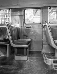 interior of a classic american bus in black and white