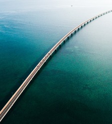 aerial view on a sunny day of a long brigde over the sea in Galicia, Spain