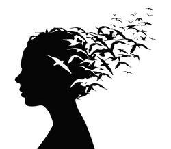 Black silhouette portrait of a pretty girl with birds flying from her head - thoughts, emotions or psychology concept