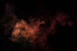  Abstract pink powder explosion on black background.