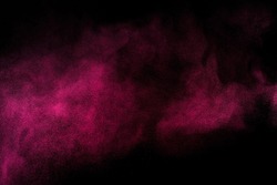  Abstract red and pink powder explosion on black background.