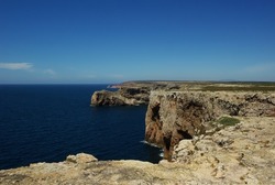 A cliff surrounded by waterscape, Algarve, Saint Vincent's cape