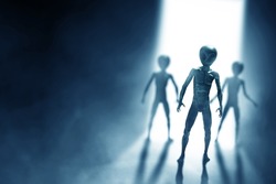 Silhouettes of aliens creature on dark background