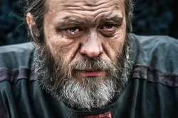 Homeless poor man crying portrait closeup. Economic recession, unemployment, poverty, hunger, retirement, global crisis, inequality problem concept. 