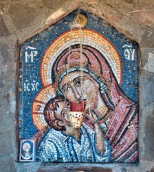 The mosaic icon of the Holy Virgin Mary and the child Jesus. Untried author. The source of holy water, the Serbian Orthodox Moraca monastery, Montenegro