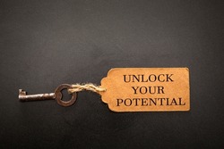 unlock your potential concept. vintage key with tag