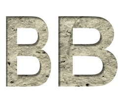 Stone letter B cut out of white paper on the background of the texture of natural stone close-up, decorative font