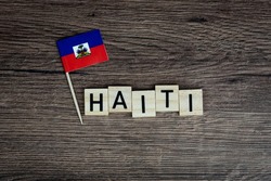 Haiti - wooden word with haitian flag (wooden letters, wooden sign)