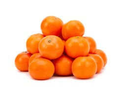 Heap of ripe tangerines on a white background. Tangerines close up. Tangerines isolate on a white background.