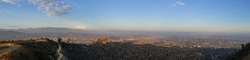 Panoramic view of the city Los Angeles surrounded by the mountains