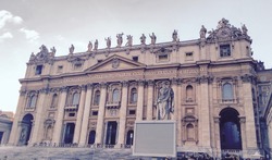 Retro photo of St. Peter Basilica front entrance with statues, Vatican Rome