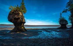 At Hopewell Rocks one can experience the world's highest tides. The tides rise up to 4 meters (13 feet) per hour and can reach a height of up to 14 meters (46 feet), New Brunswick, New England, Canada