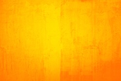 Old cracked painted yellow or orange wall, background texture, suitable for adding text or graphic  