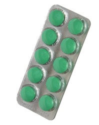 Tablets of green color are a blister on a white background.