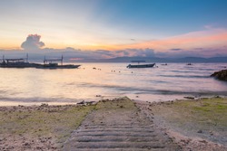 Sunset view of the Moalboal beach famous diving and snorkeling spot in Cebu with Negros island on the background, Philippines
