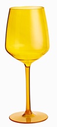 Yellow plastic cup like wine glass transparent isolated on white background. 
unbreakable glass. cup with tall pedestal.