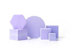 A composition of various geometric shapes. Purple shapes of different sizes, cube, circle, hexagon on an isolated background. A set of pedestals