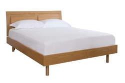 The wood bed with white bedding isolated on the white background.