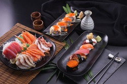 Sashimi and sushi Japanese food set. Salmon, Ikura, wasabi, fish, shrimp and tuna in a Japanese restaurant.