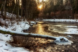 Winter Christmas Landscape, Surrounded By Trees.Winter Forest On The River. Landscape With Snowy Trees, Beautiful Frozen River With Reflection In Water. Water in frozen stream. Snowy river in forest.